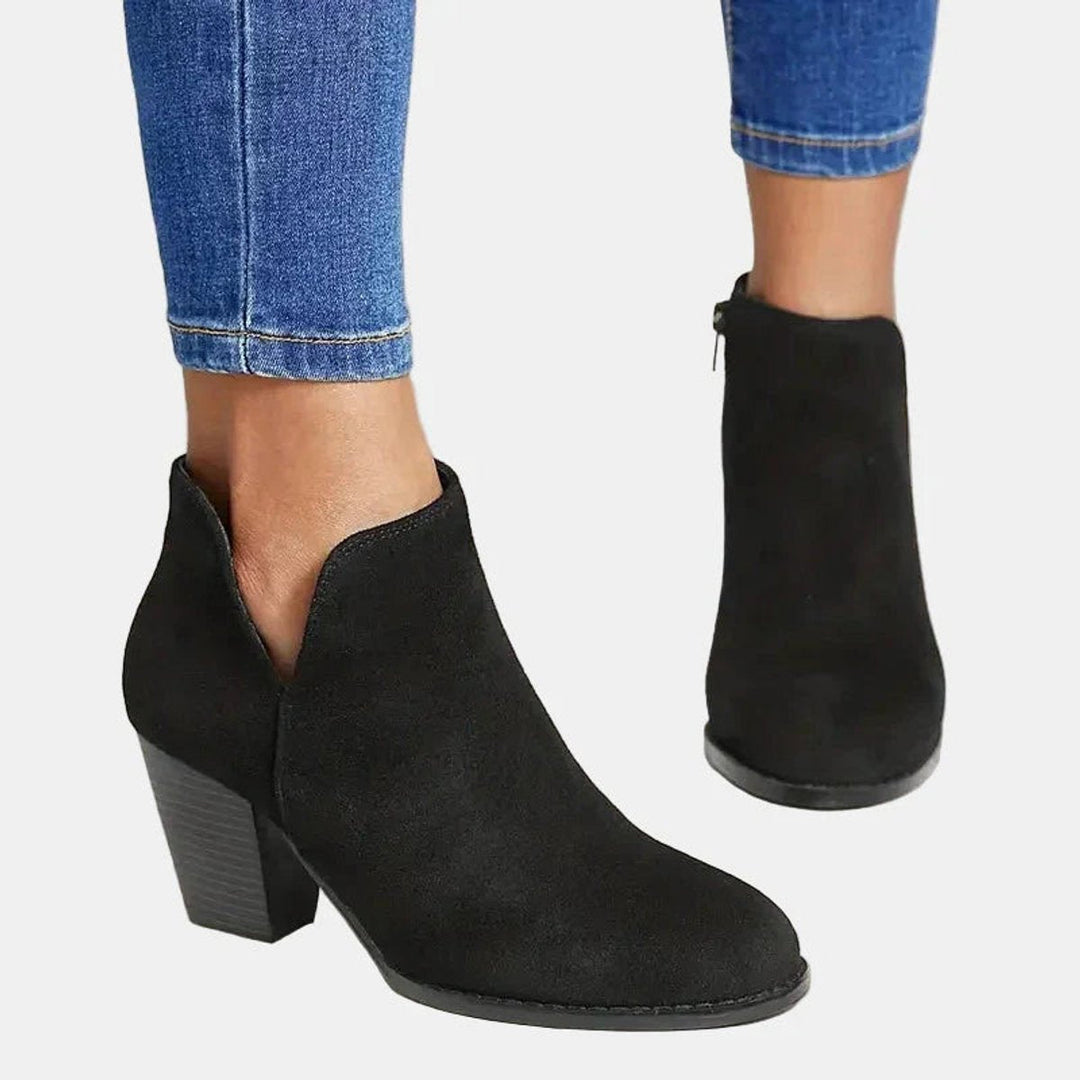 Adeline block heel ankle boots in black, close-up front view showing zip detail