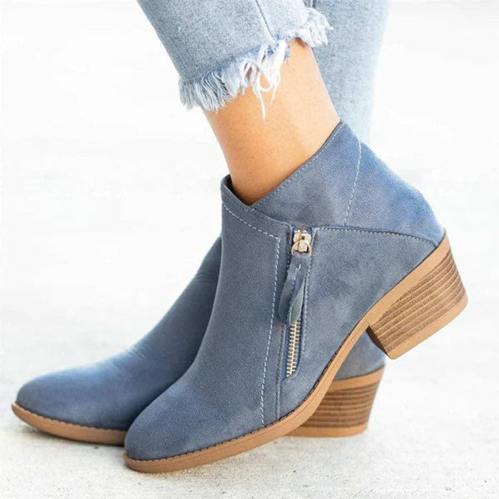 Amara block heel ankle boots in blue suede, side profile with zip detail