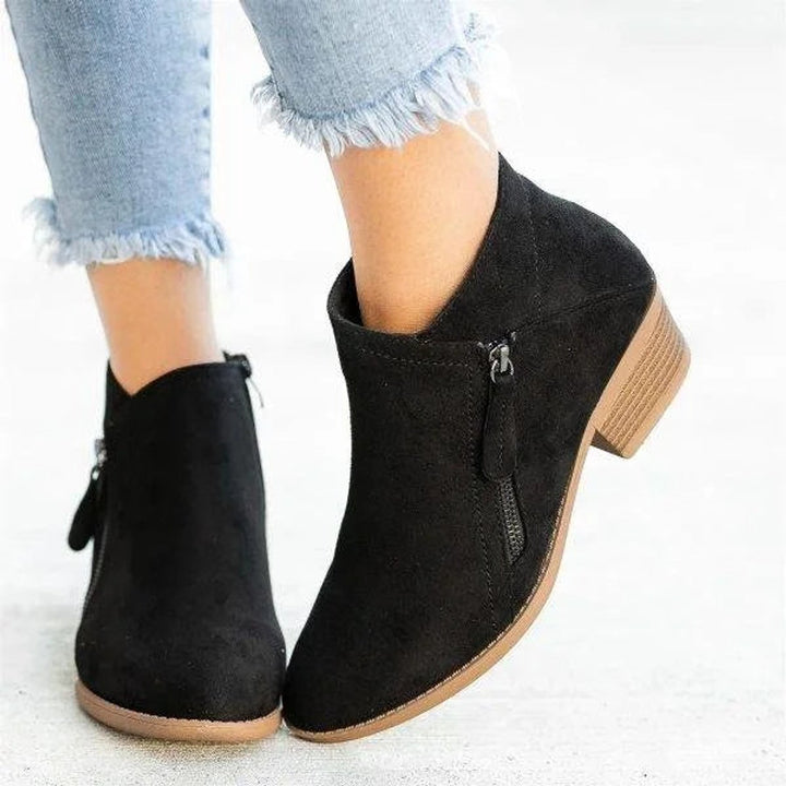 Amara block heel ankle boots in black suede, close-up rear and side angle