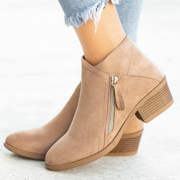 Amara block heel ankle boots in beige suede, side profile with zip detail
