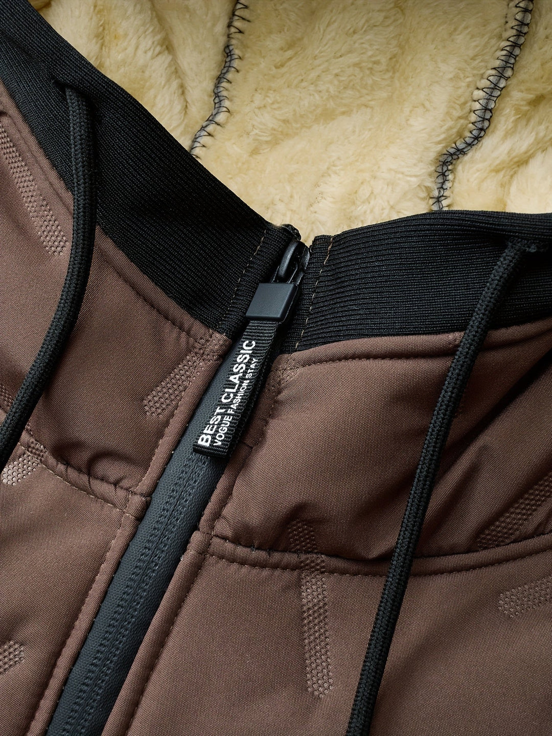 Close-up of Barnaby jacket zip pull and fleece hood lining detail