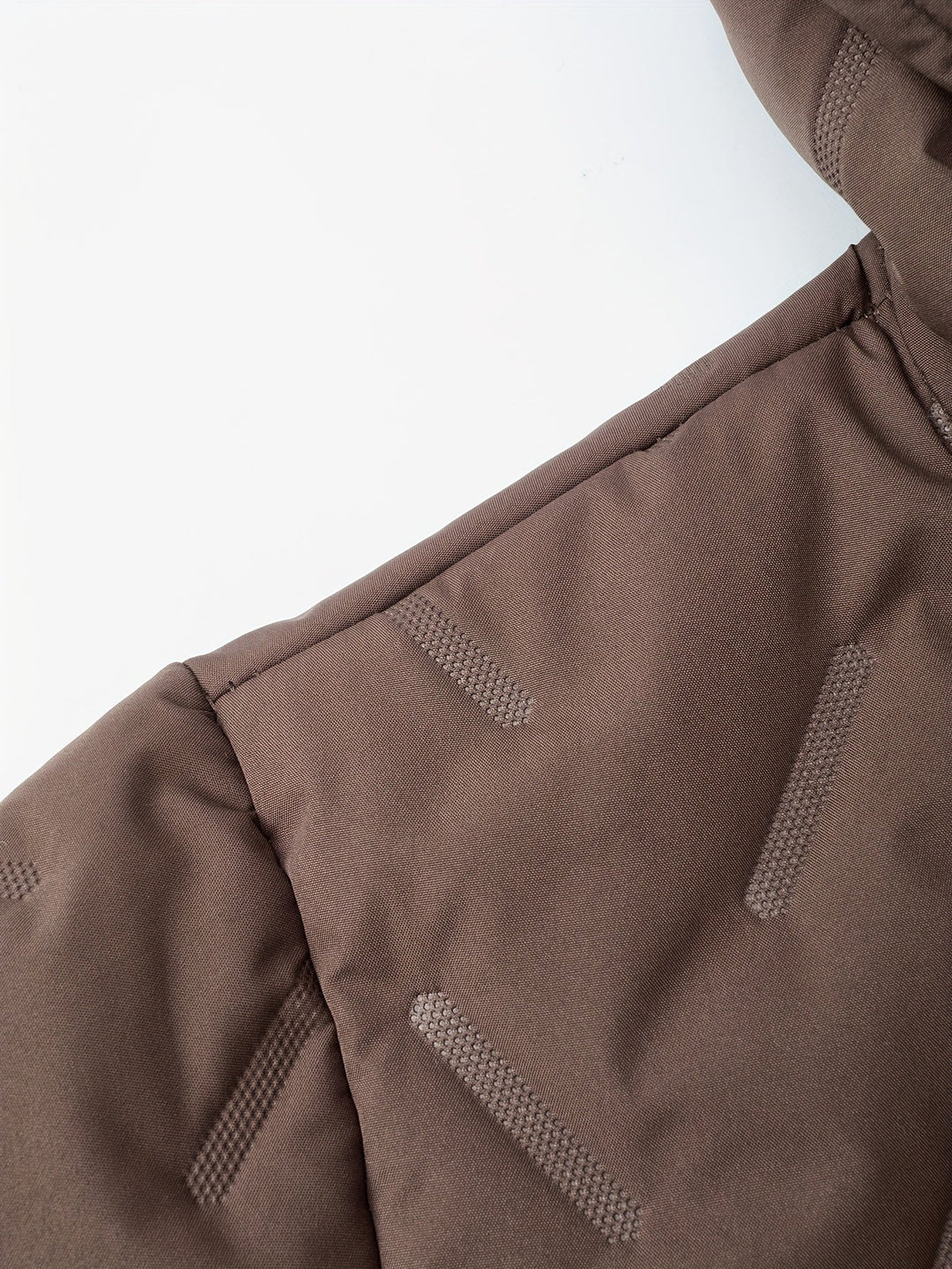 Close-up of Barnaby jacket textured quilted fabric detail