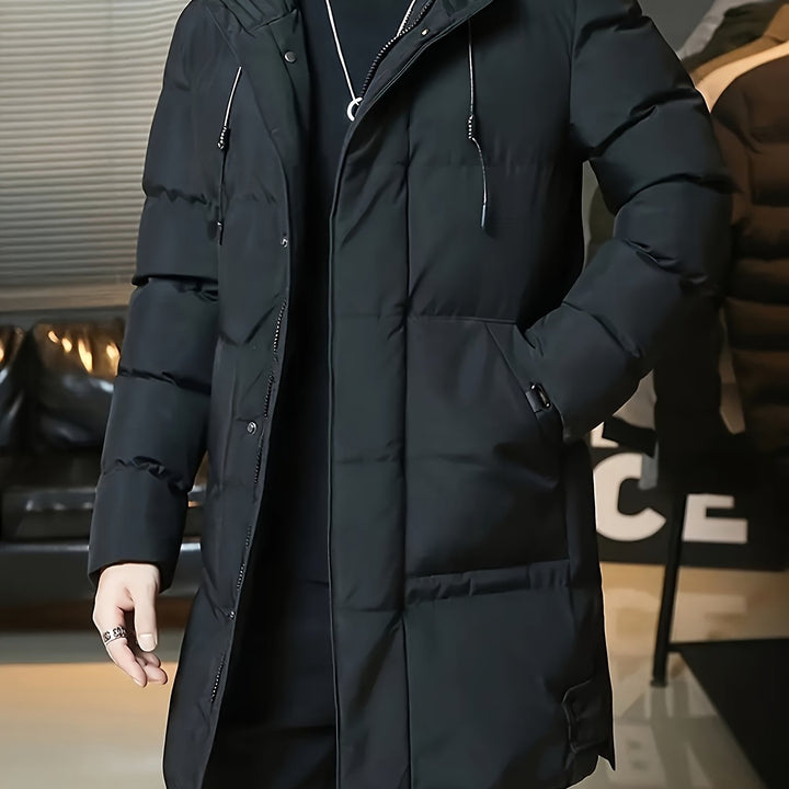 Barnaby hooded longline puffer coat in black, close-up front view with drawstring hood