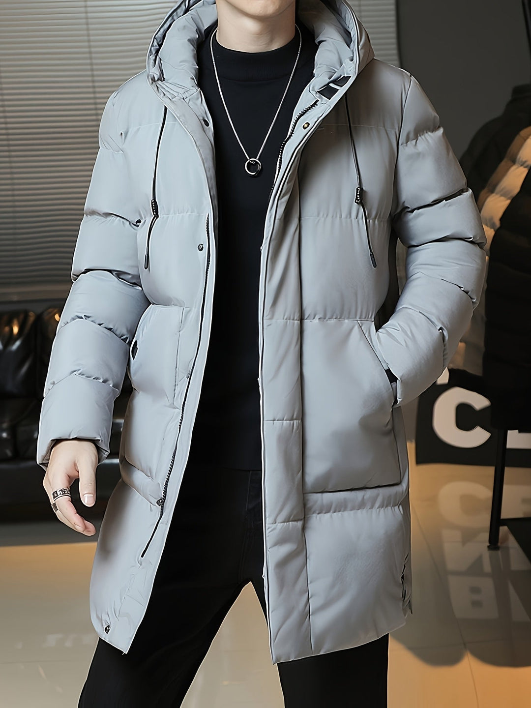Man wearing Barnaby grey coat open, showing interior lining