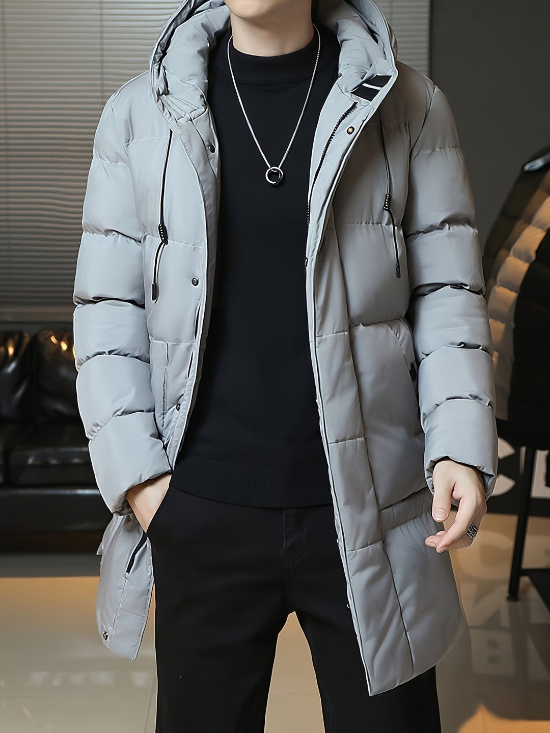 Man wearing Barnaby grey coat, front view with hands in pockets