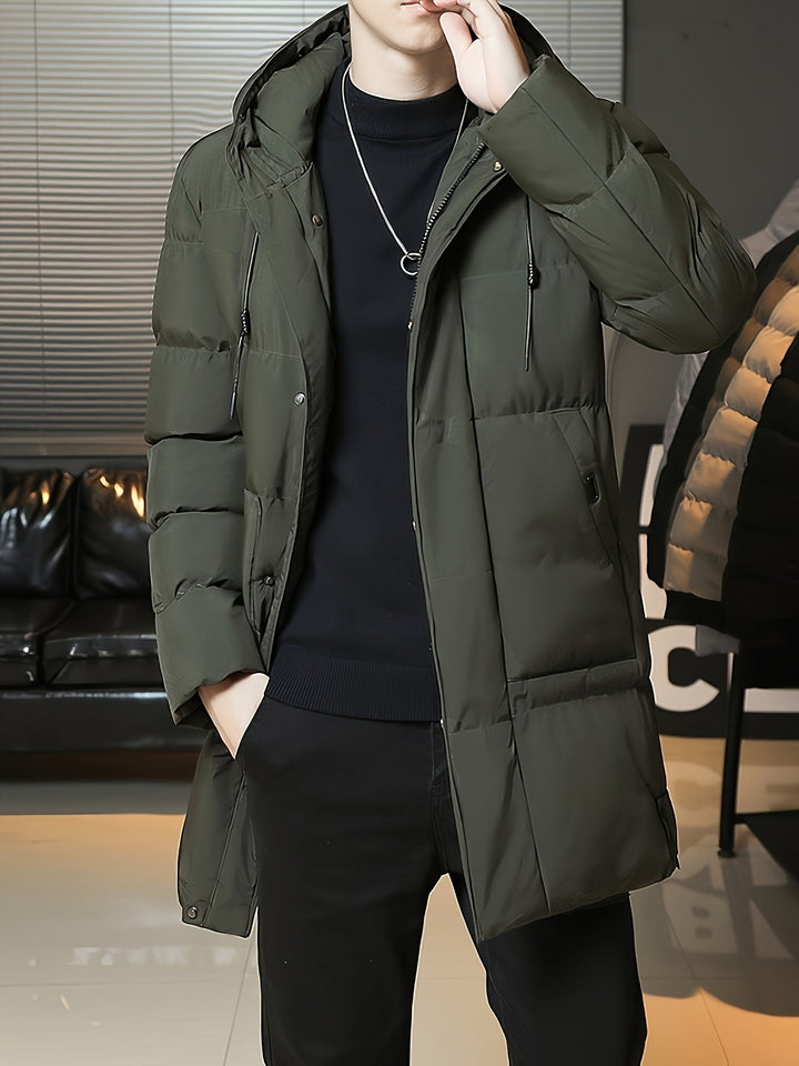 Man wearing Barnaby green coat, back three-quarter view showing hood