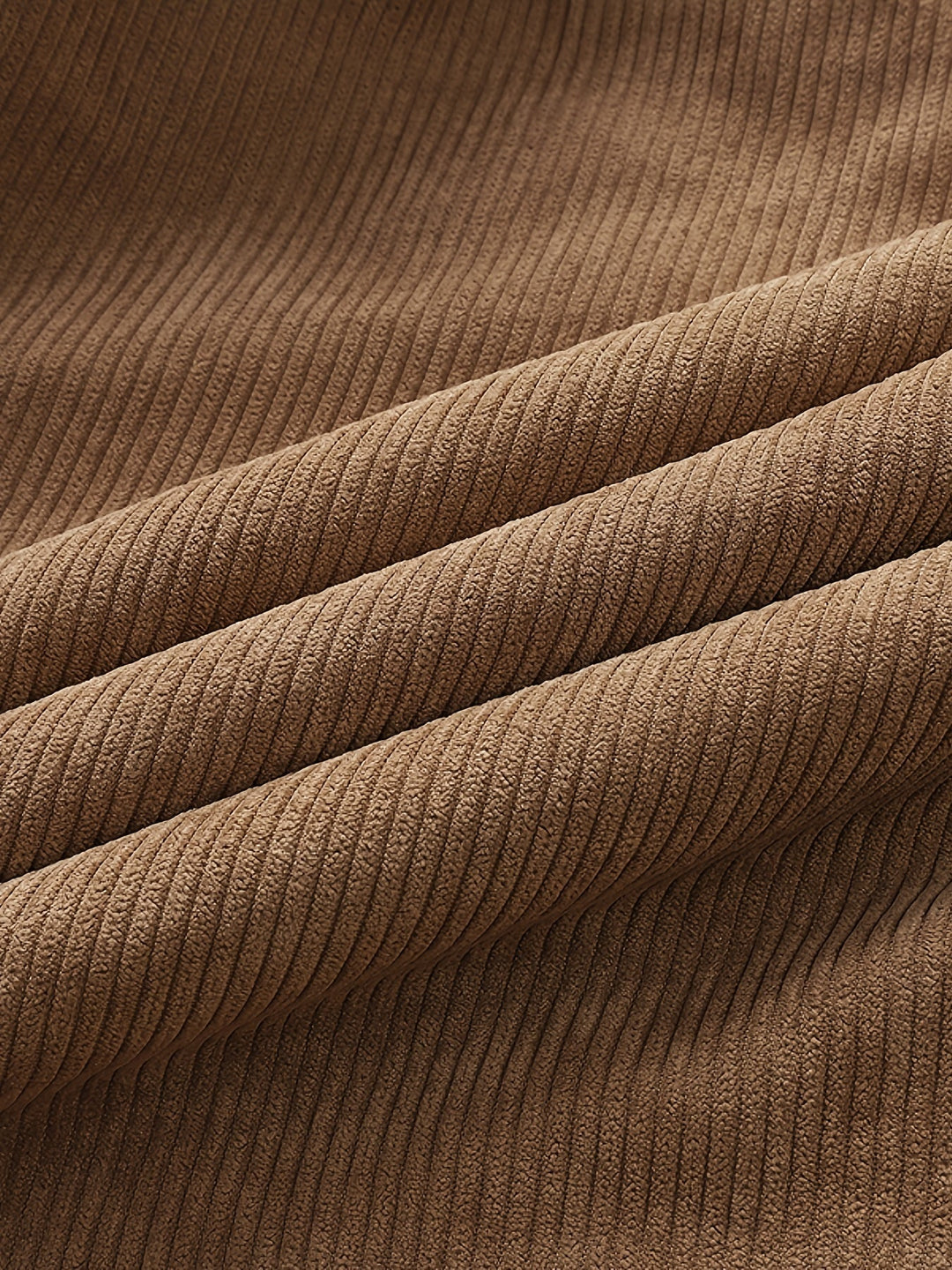 Close-up of corduroy fabric texture in tan