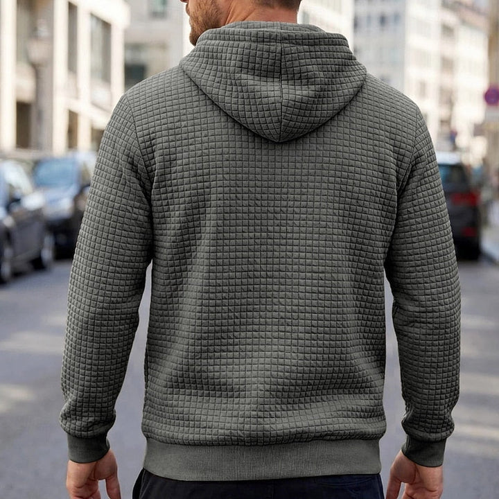 Callum grey textured waffle hoodie, back view on model
