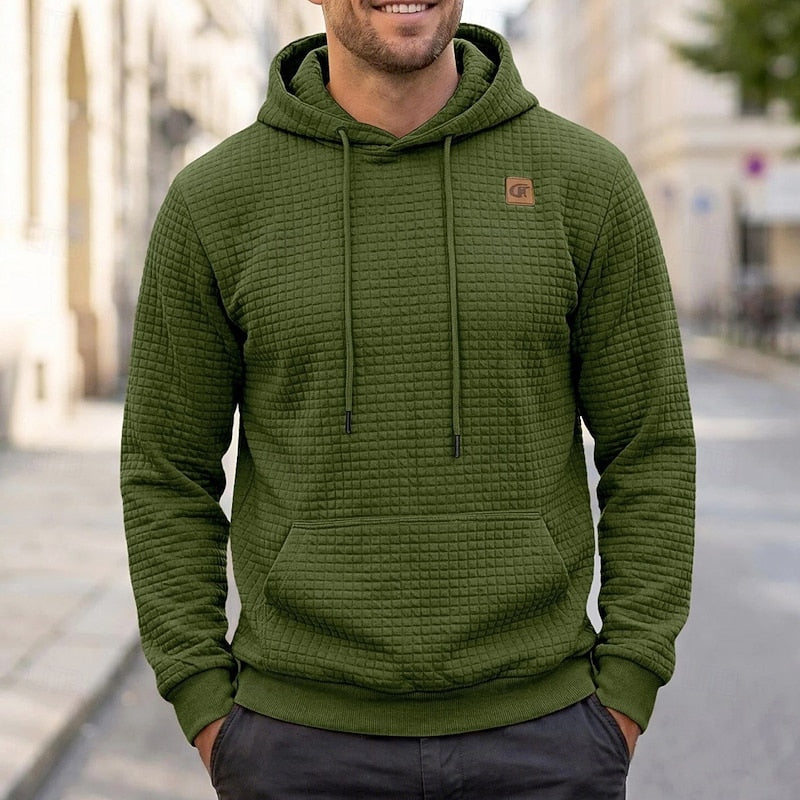 Callum army green textured waffle hoodie, front view on model