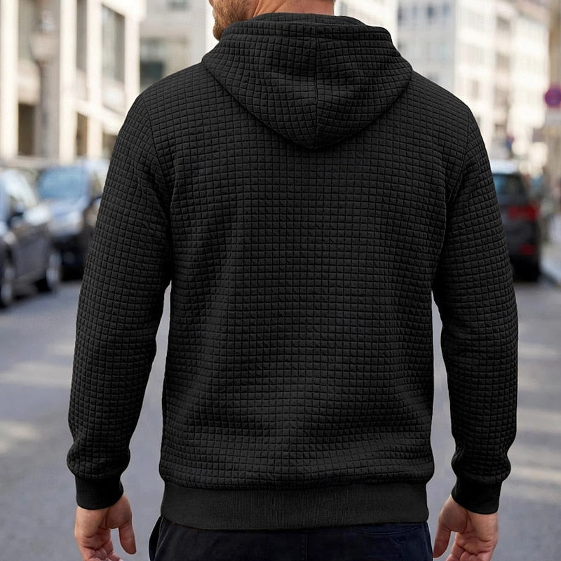 Callum black textured waffle hoodie, back view on model