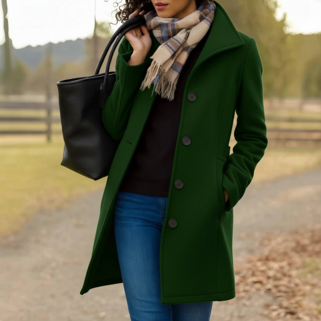Cecily classic single-breasted mid-length coat in dark green, front view with scarf and tote bag