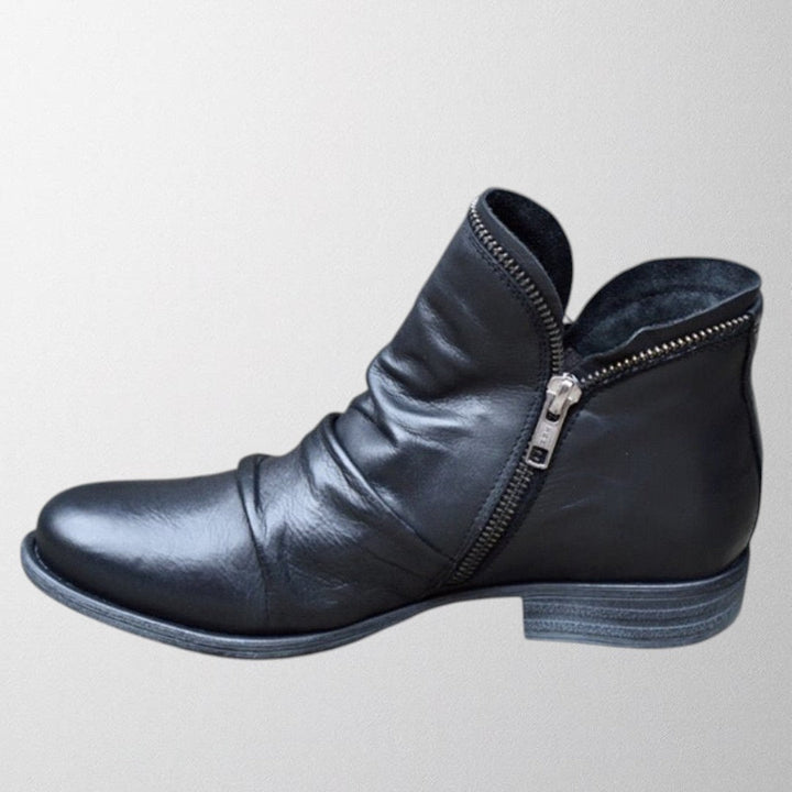 Clementine slouch ankle boot in black with side zip detail, side view