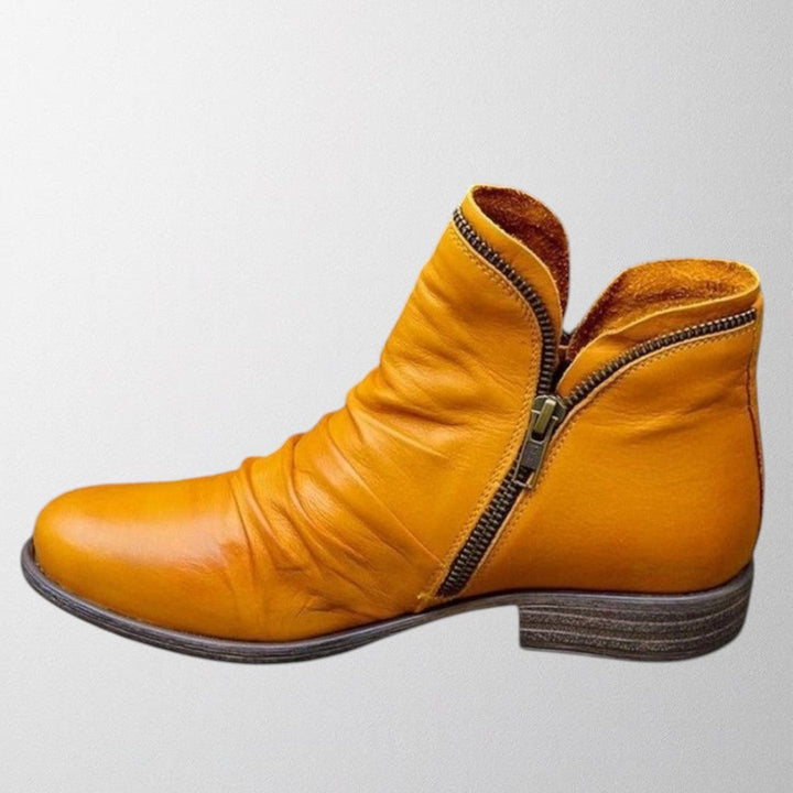 Clementine slouch ankle boot in yellow with side zip detail, side view