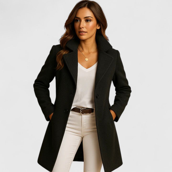 Cressida notched lapel double-breasted midi coat in black, front view with hands in pockets