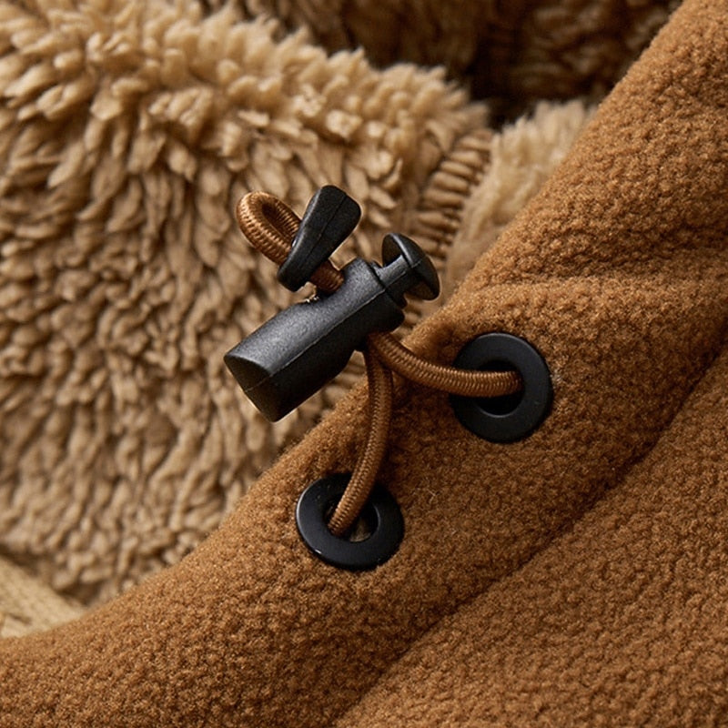 Close-up of the adjustable hood toggle and sherpa lining