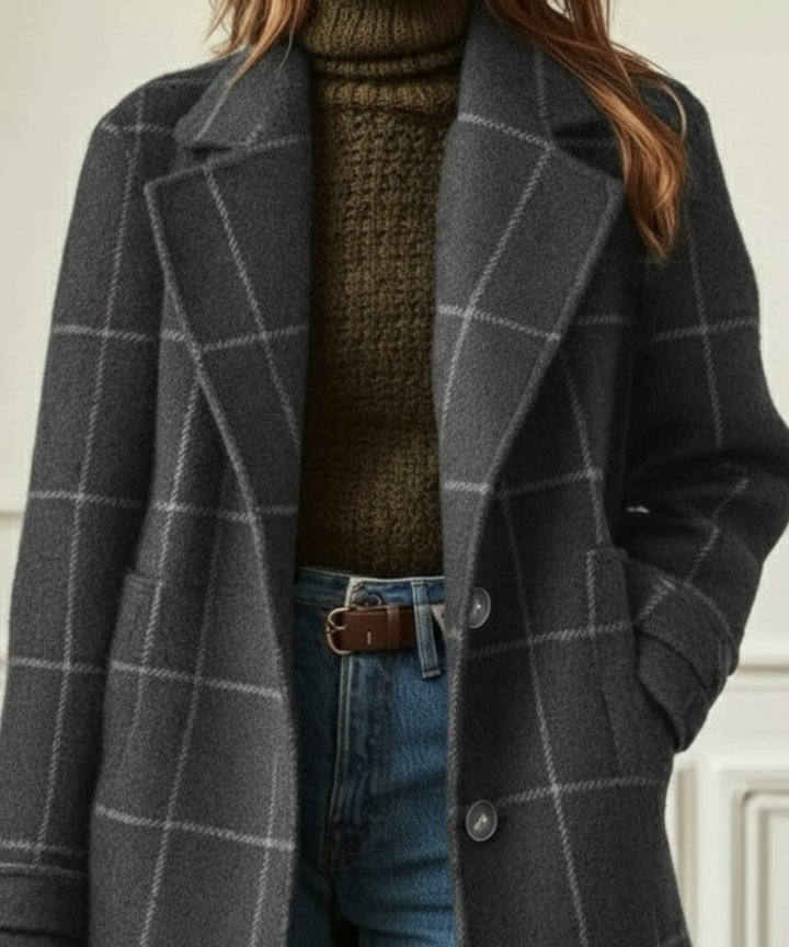 Close-up of Eleanor coat's lapel collar and button front, grey check
