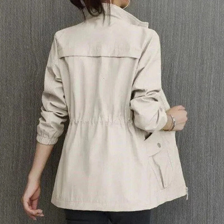Felicity zip-up jacket in beige, back view with cargo pockets