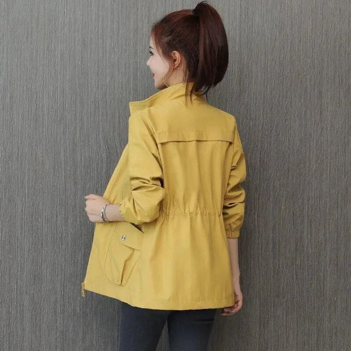 Felicity bomber jacket in yellow, back view styled with jeans