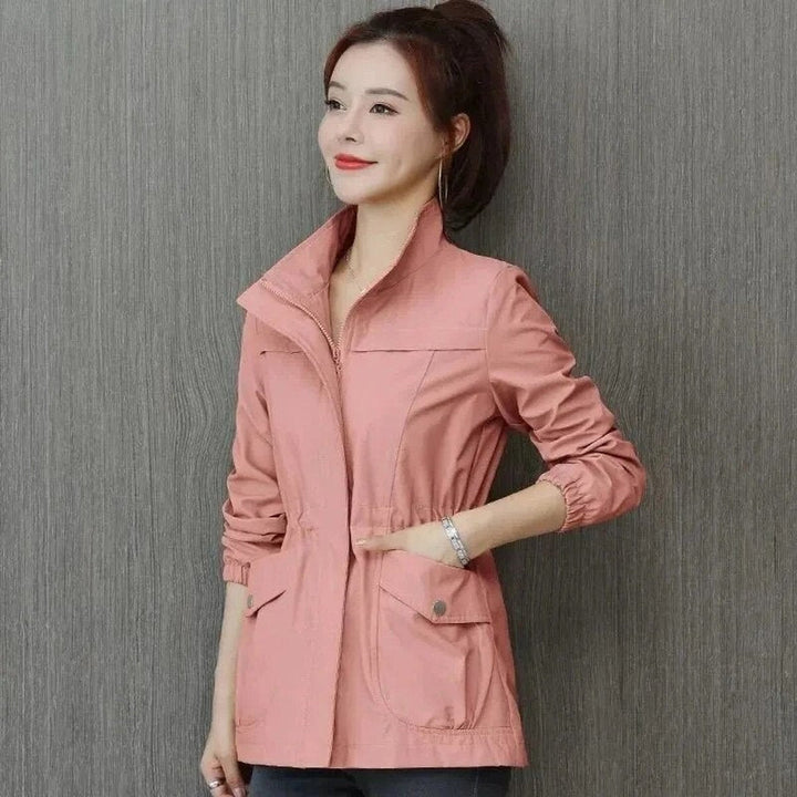 Felicity zip-up jacket in pink, side view with hand in flap pocket