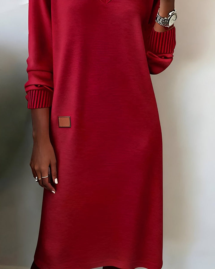 Freya red midi dress, close-up of sleeve and leather patch detail