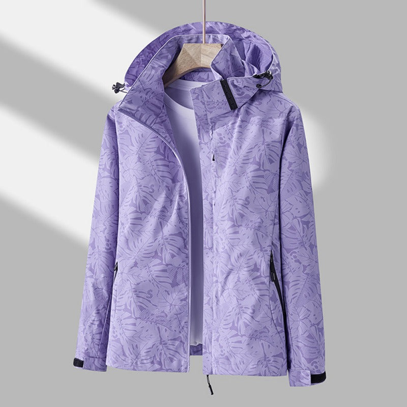 Freya hooded leaf print rain jacket in purple, front view on hanger