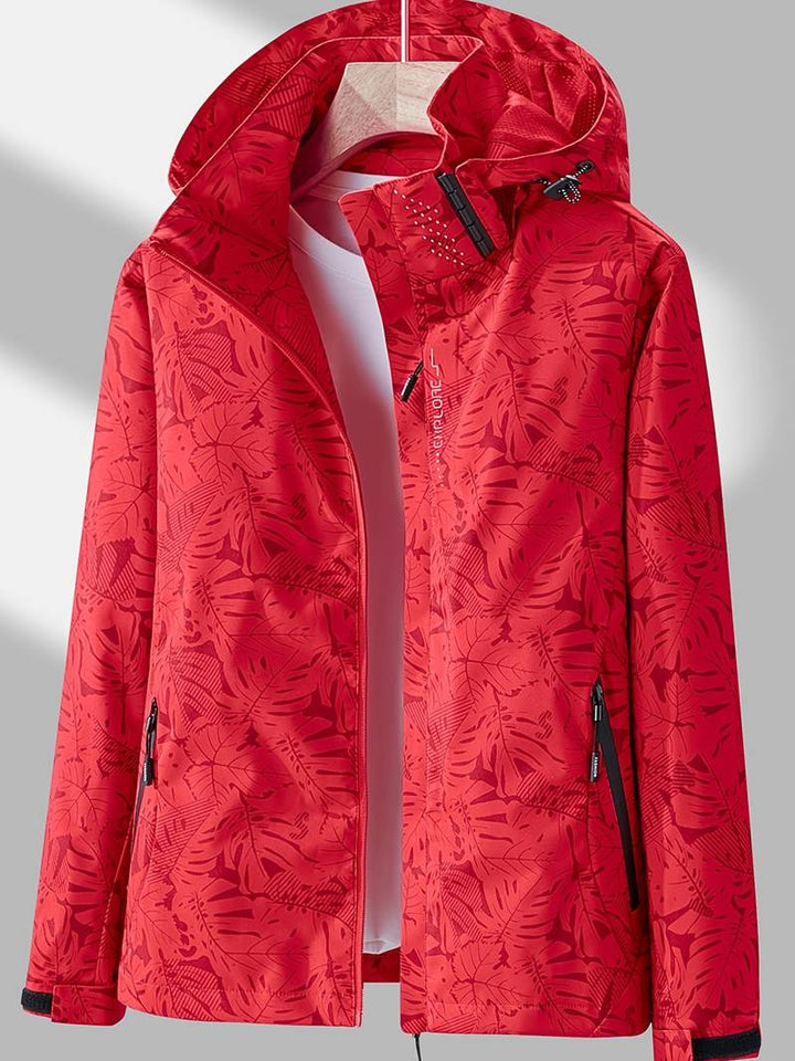 Freya hooded leaf print rain jacket in red, front view on hanger
