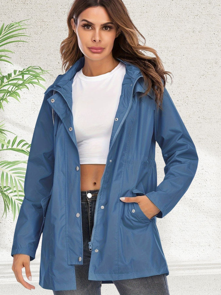 Freya hooded rain jacket in blue, front view with snap button and zip closure