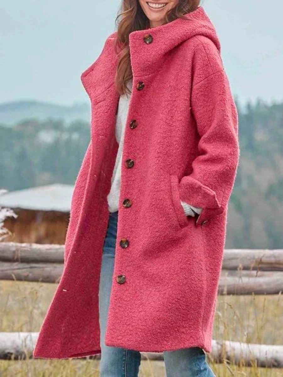 Genevieve hooded button-front long coat in pink, side view with hand in pocket