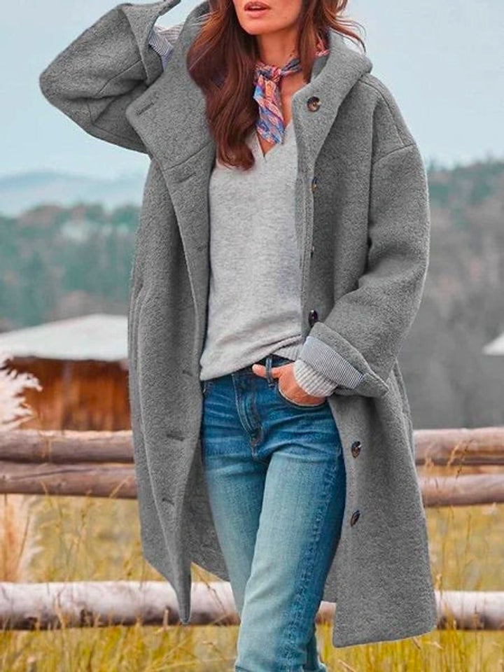 Genevieve hooded button-front long coat in grey, front view with hood raised