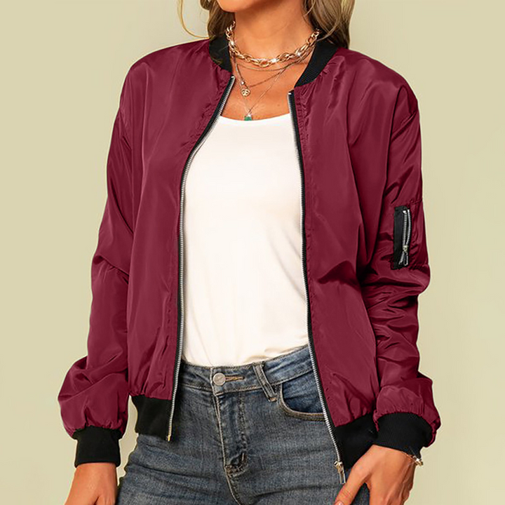 Harlow zip-up bomber jacket in burgundy, styled with jeans