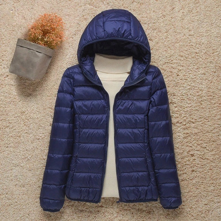 Harriet lightweight hooded packable puffer jacket in navy blue, front view
