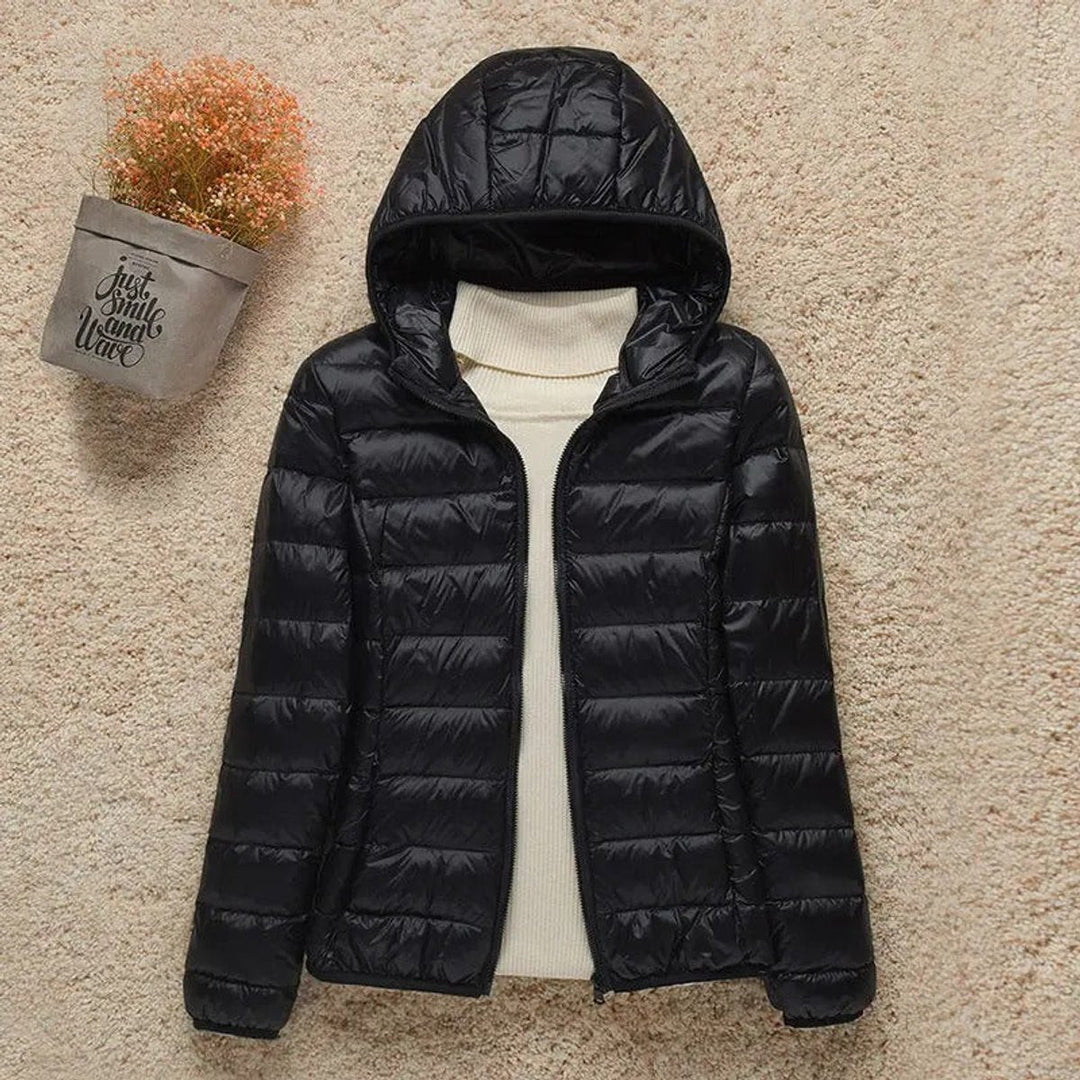 Harriet lightweight hooded packable puffer jacket in black, front view