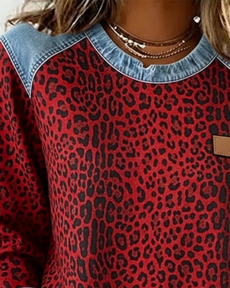 Isadora red leopard print sweatshirt, neckline detail close-up