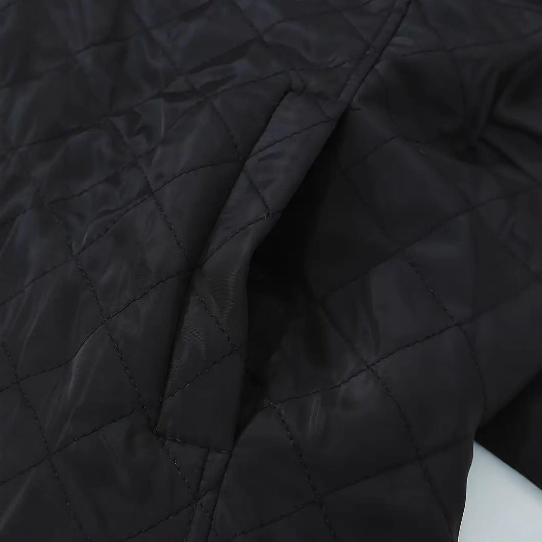 Josephine quilted puffer jacket worn open, holding coffee cup street style