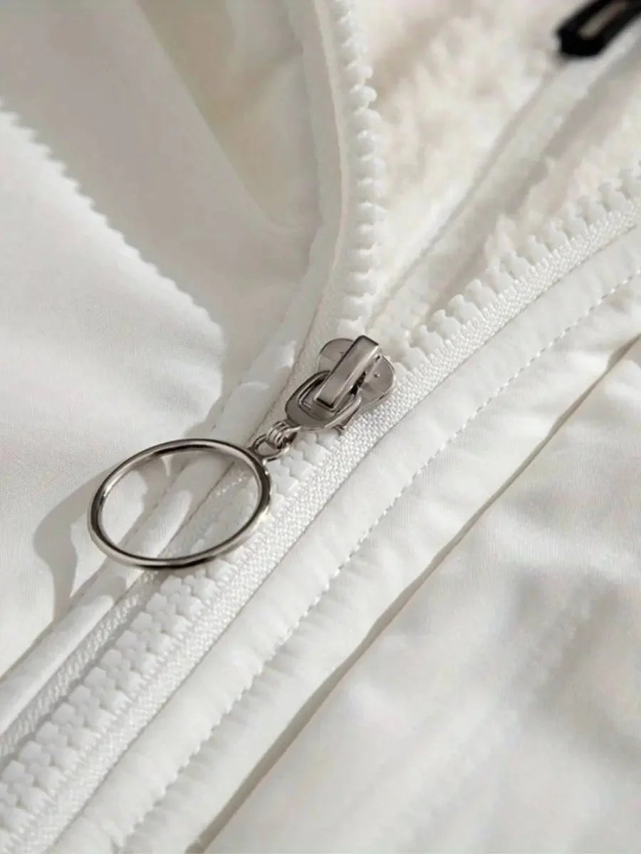 Close-up of zip pull detail on white Josephine puffer jacket