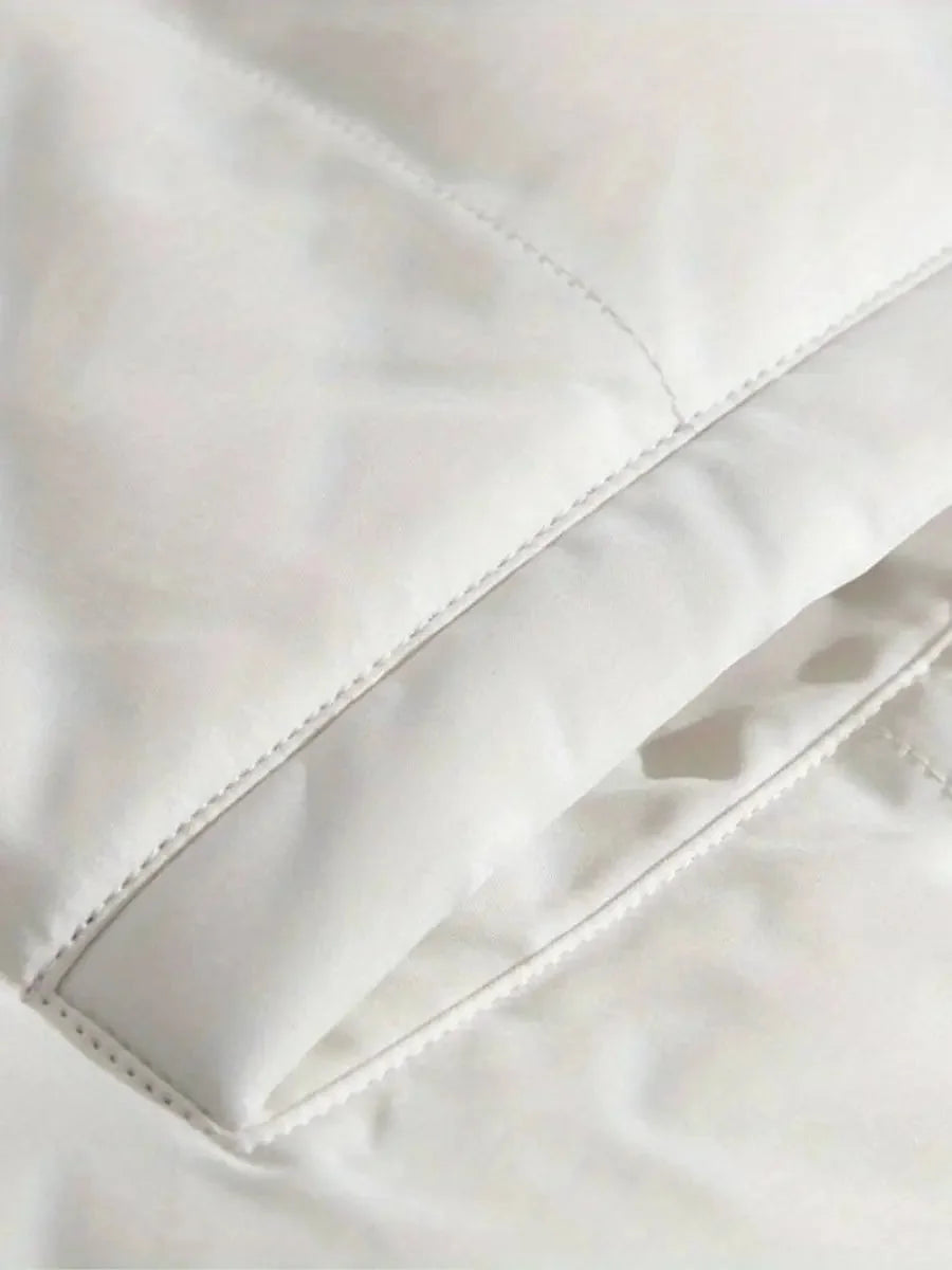 Close-up of pocket stitching on white Josephine puffer jacket