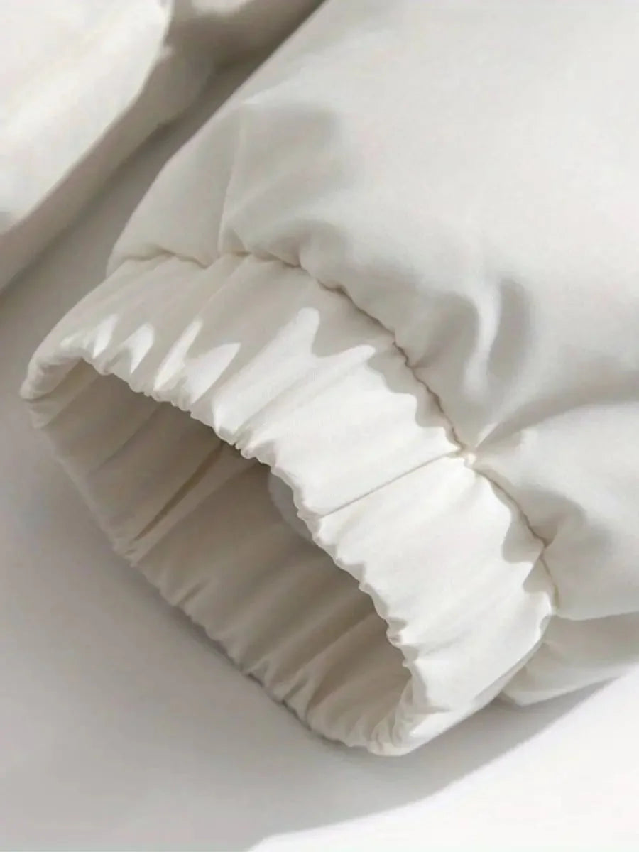 Close-up of elasticated cuff on white Josephine puffer jacket