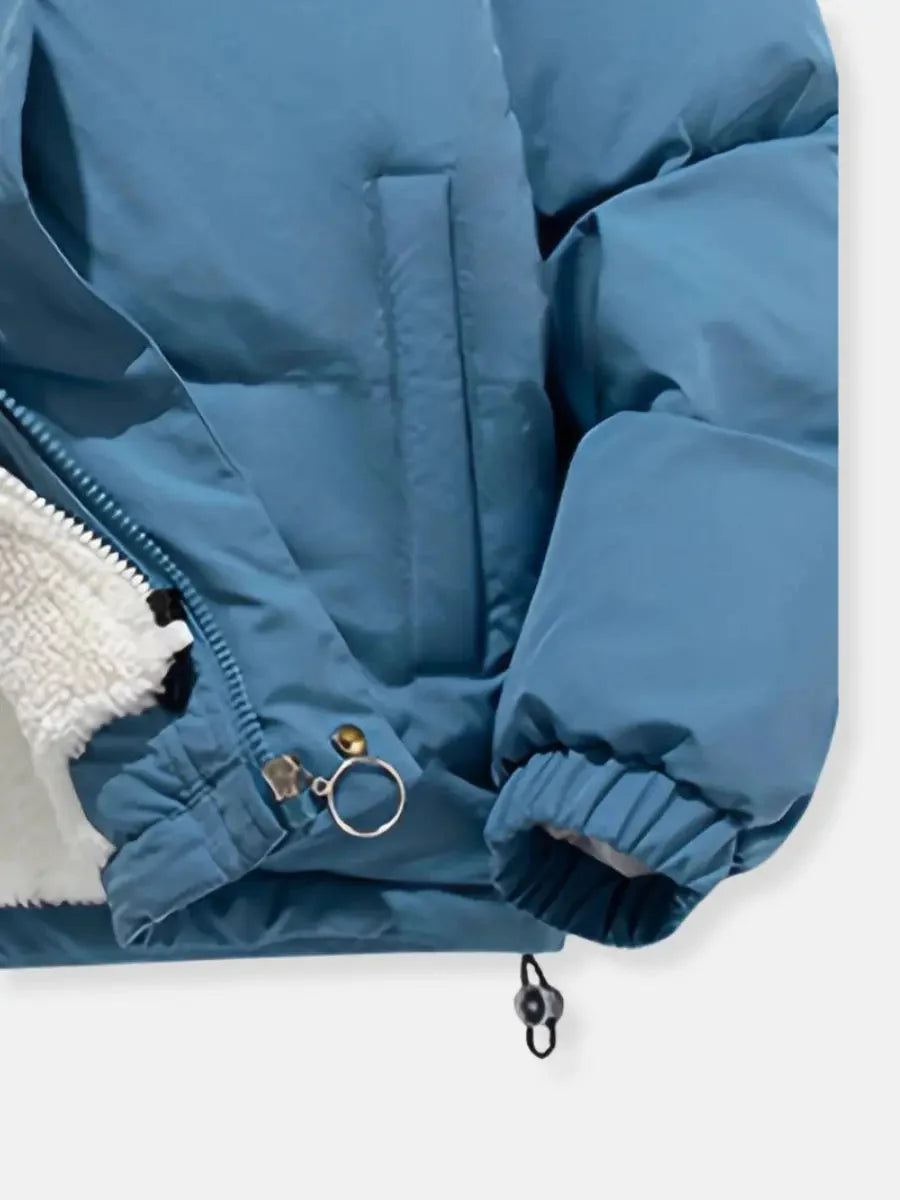Close-up of cuff and zip detail on blue Josephine puffer jacket