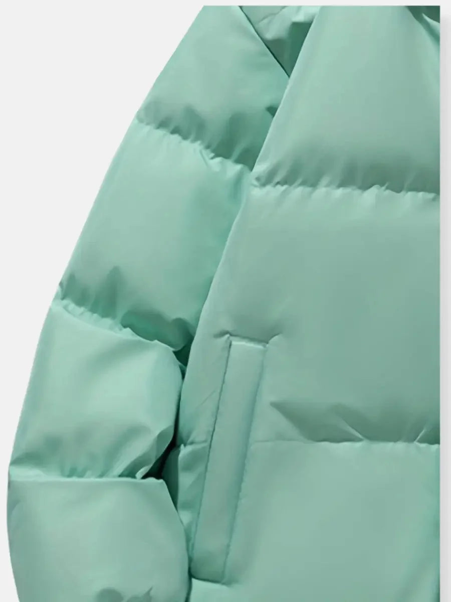 Close-up of pocket detail on mint green Josephine puffer jacket