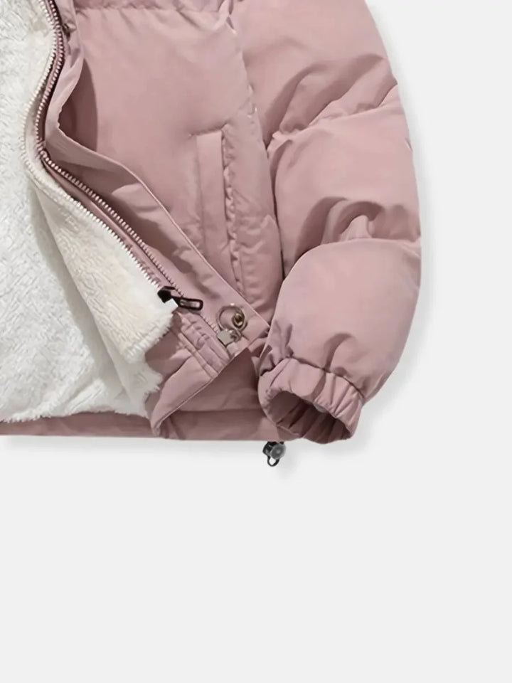 Close-up of sleeve and zip lining on pink Josephine puffer jacket