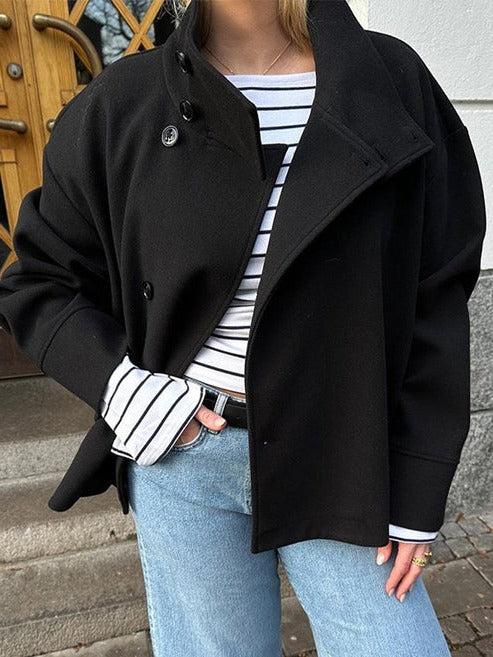 Marguerite double-breasted oversized short coat worn open over striped top and jeans, front view close-up
