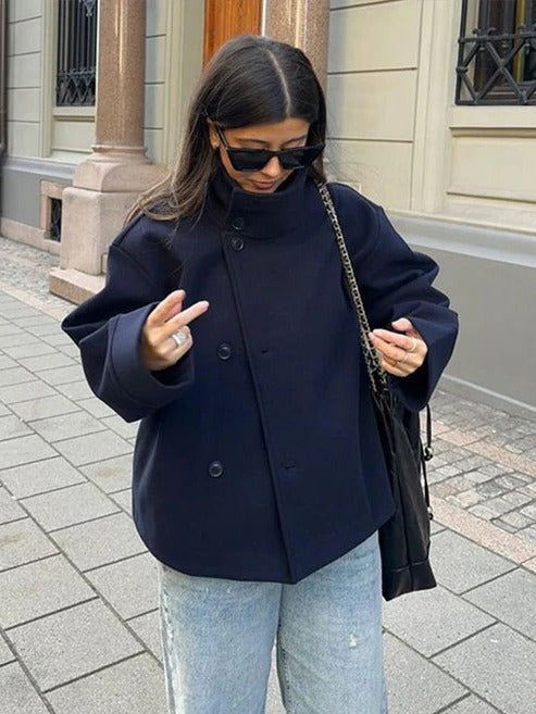 Marguerite double-breasted oversized short coat worn buttoned with stand collar, front view