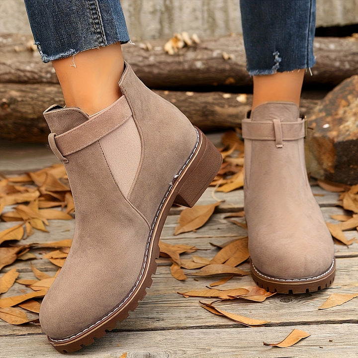 Marigold buckle strap Chelsea boots in taupe, top view on feet