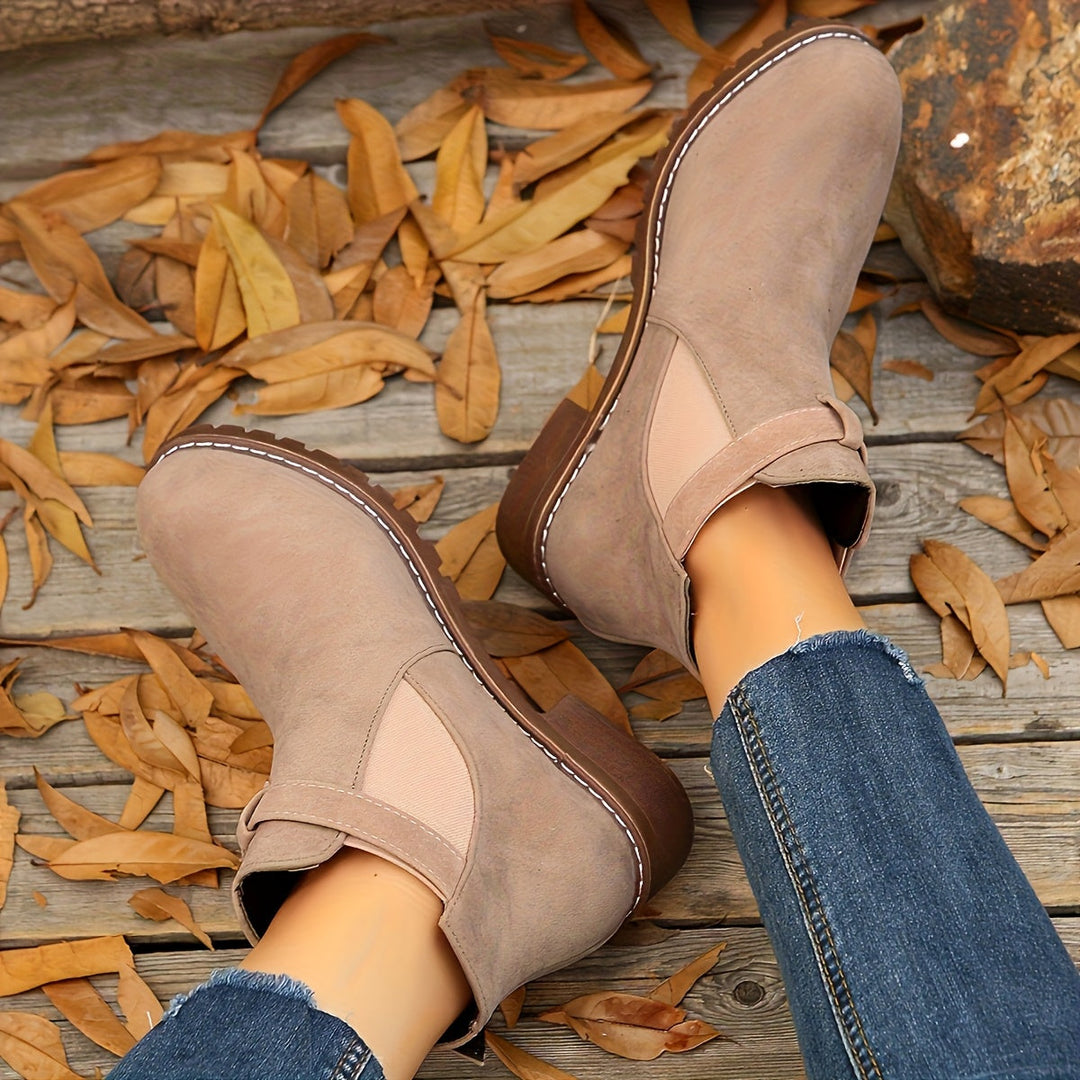 Marigold buckle strap Chelsea boots in taupe, top view on feet