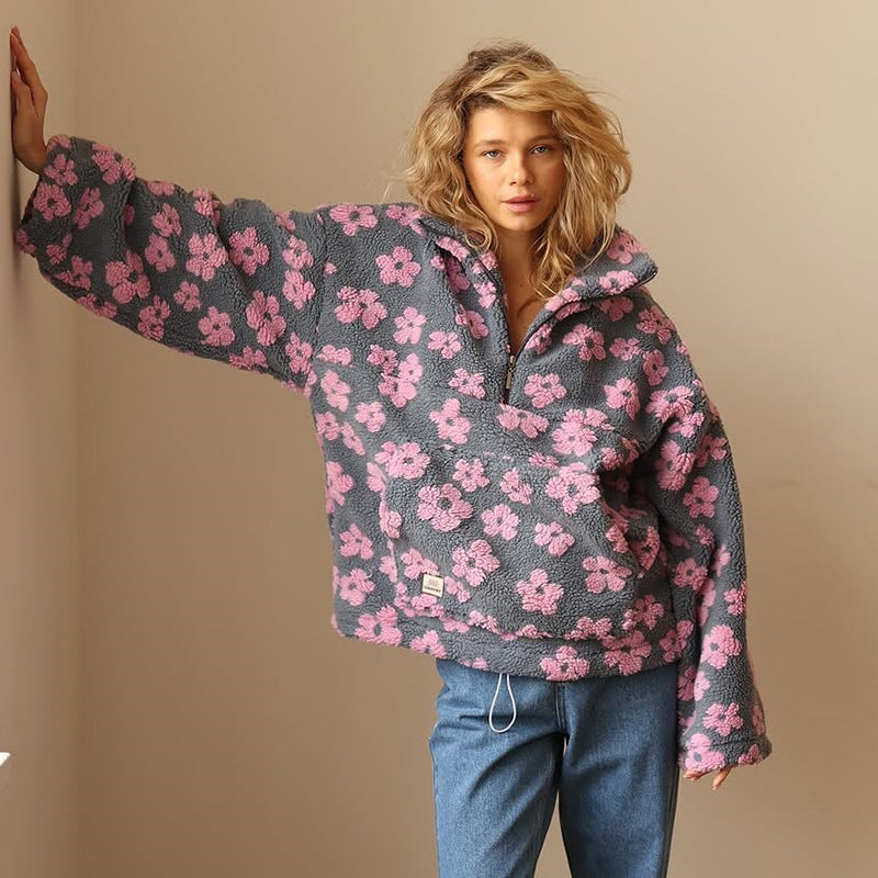 Meredith floral quarter-zip fleece pullover in pink, standing pose with arm raised