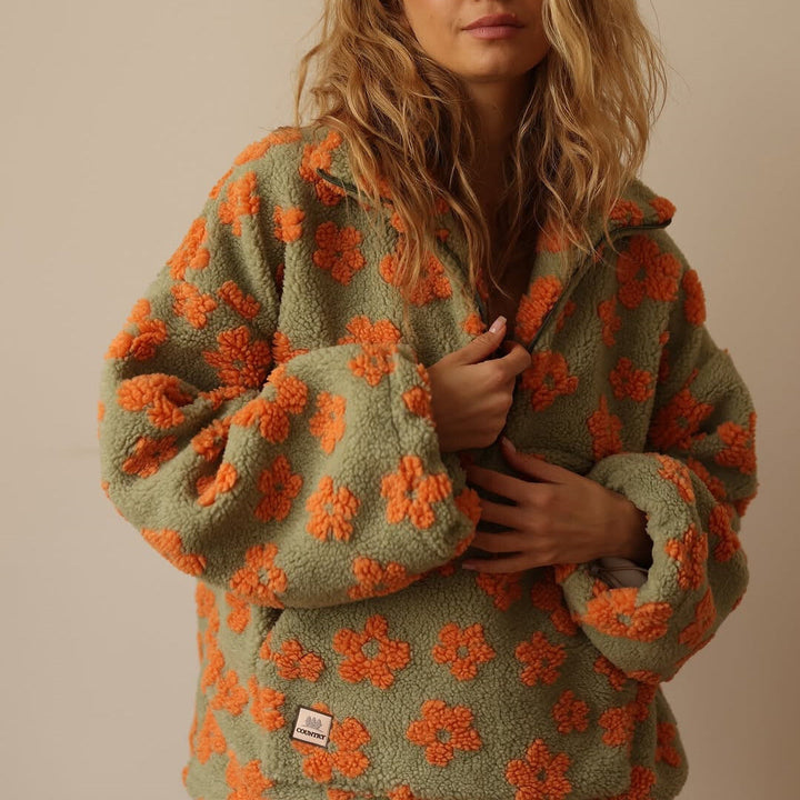 Meredith floral quarter-zip fleece pullover in green, close-up of sleeve and pocket