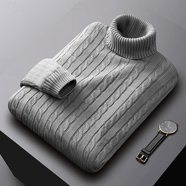 Percival light grey cable knit turtleneck jumper folded, three-quarter view