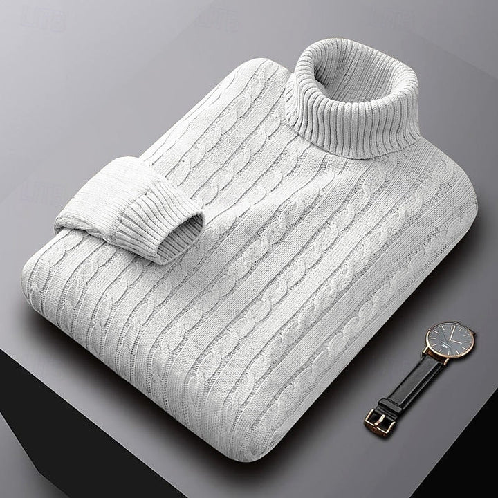Percival white cable knit turtleneck jumper folded, three-quarter view