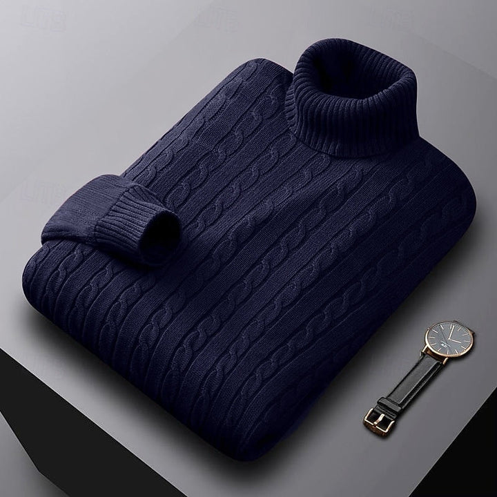Percival navy blue cable knit turtleneck jumper folded, three-quarter view