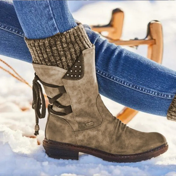 Perpetua khaki lace-up mid-calf boots shown close up in snow